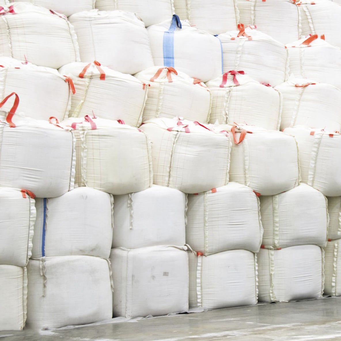 Bags of high-quality ICUMSA 45 cane sugar stacked at our Brazilian refinery.